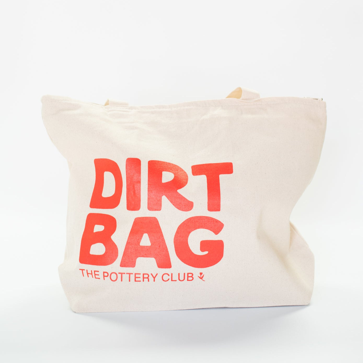 Canvas bag with 'Dirt Bag' text and 'The Pottery Club' logo on a white background